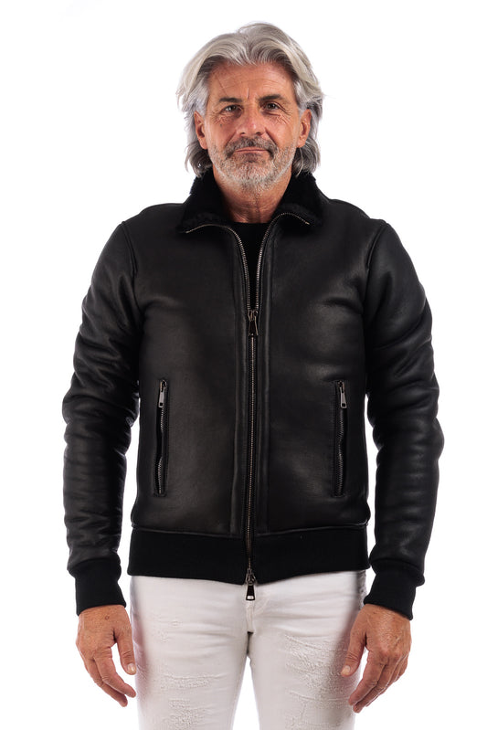 Bomber interamente in montone nero pelo nero con zip